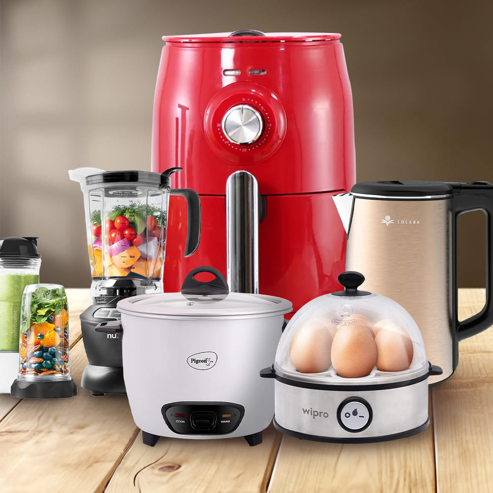 Kitchen appliances including an air fryer, blender, kettle, rice cooker, and egg boiler